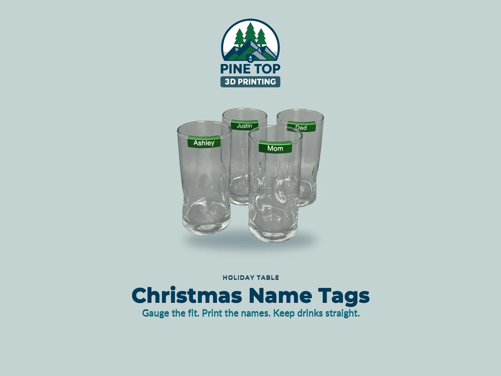 Four holiday glasses with printed clip-on name tags around a festive table