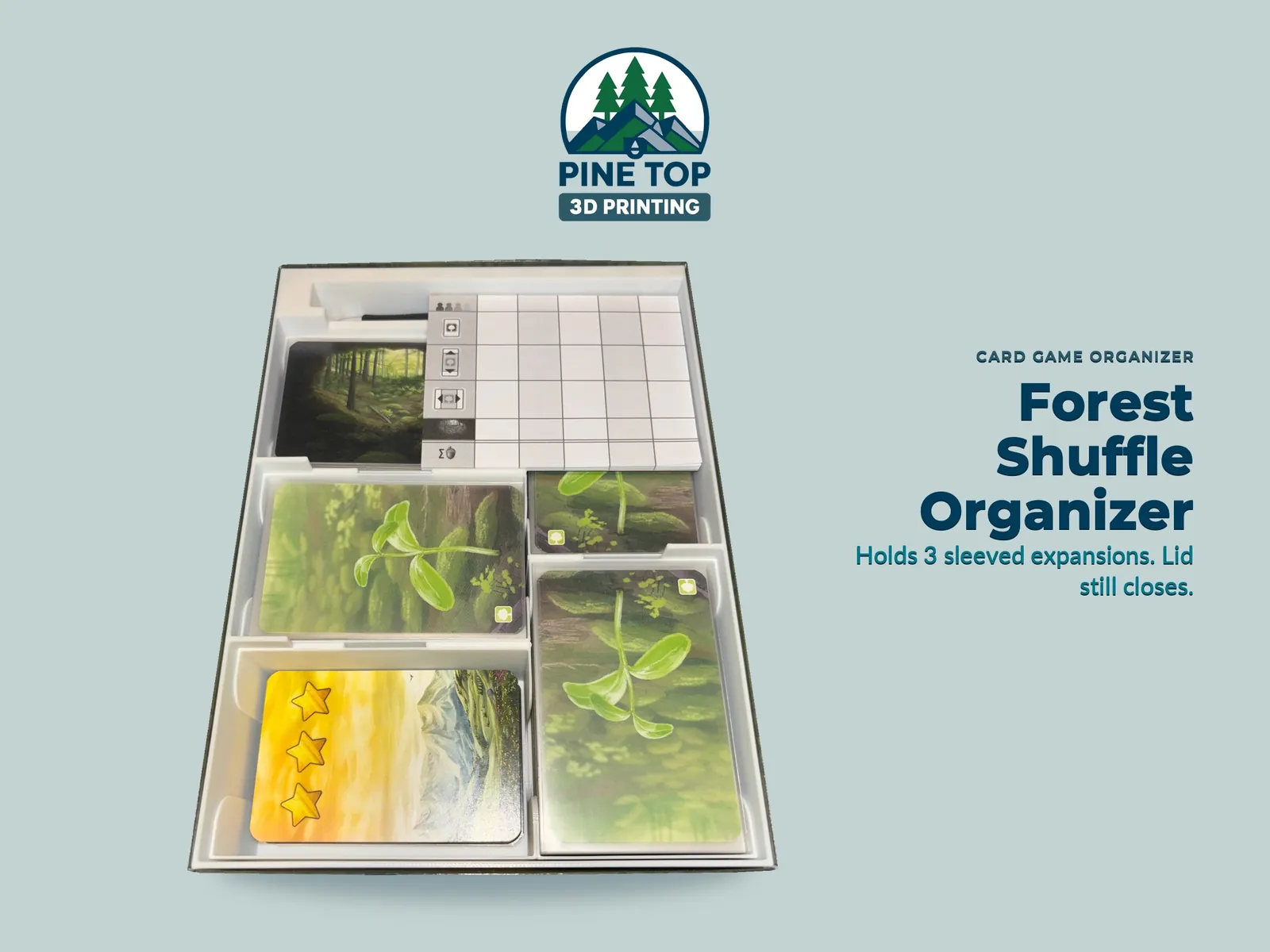 The Forest Shuffle insert loaded with sleeved cards, clearing board and rulebooks in the original game box
