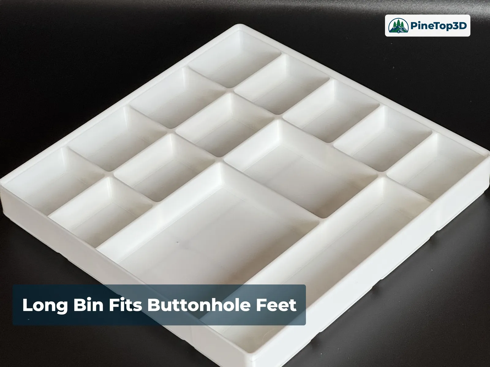 The long internal bin holding an automatic buttonhole foot