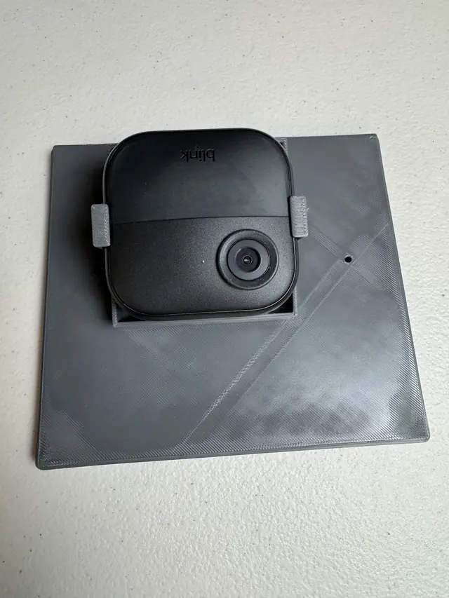 Blink camera clipped into the printed cradle on the roof panel