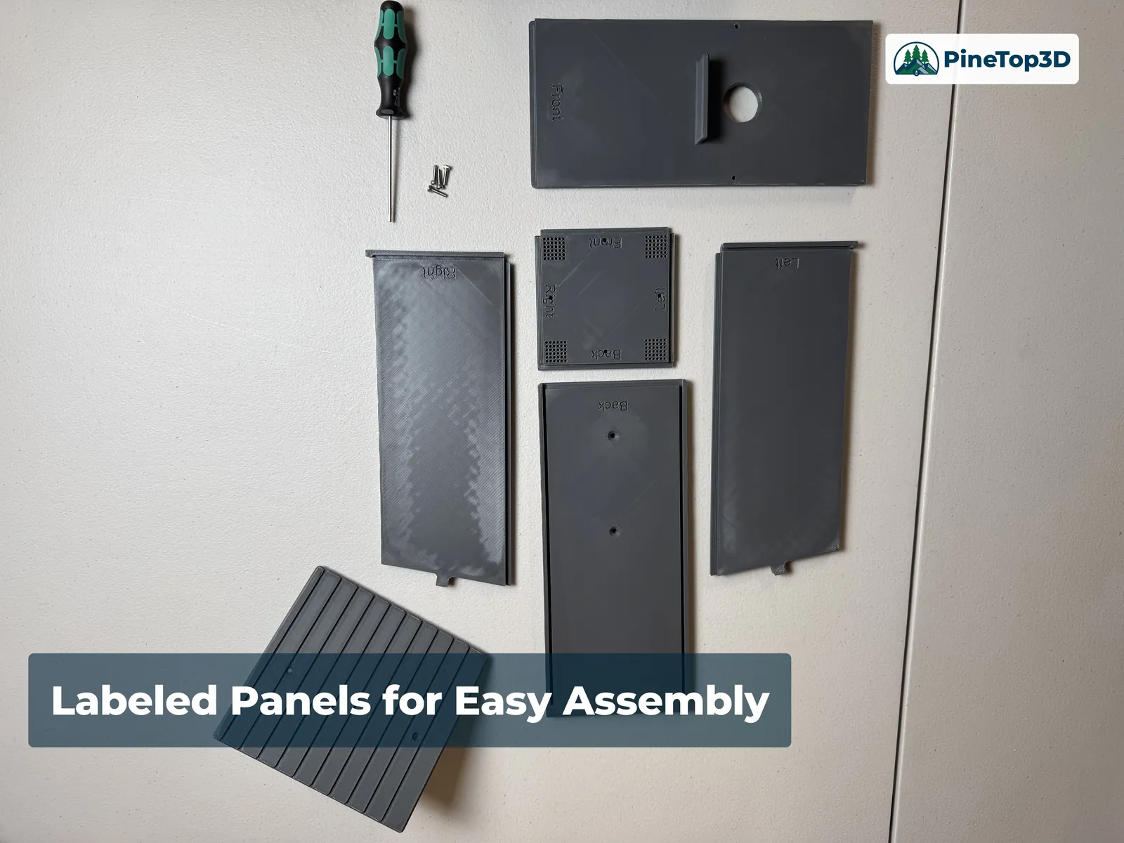 The flat-packed printed panels laid out and labeled for assembly